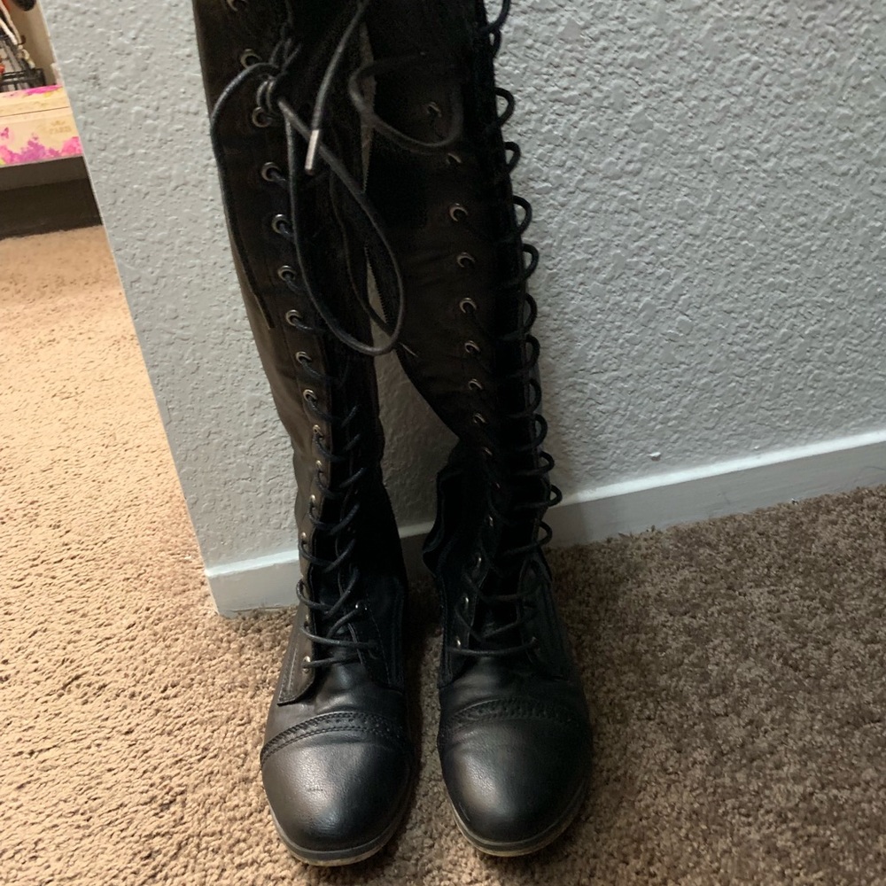 Lace up thigh high boots.